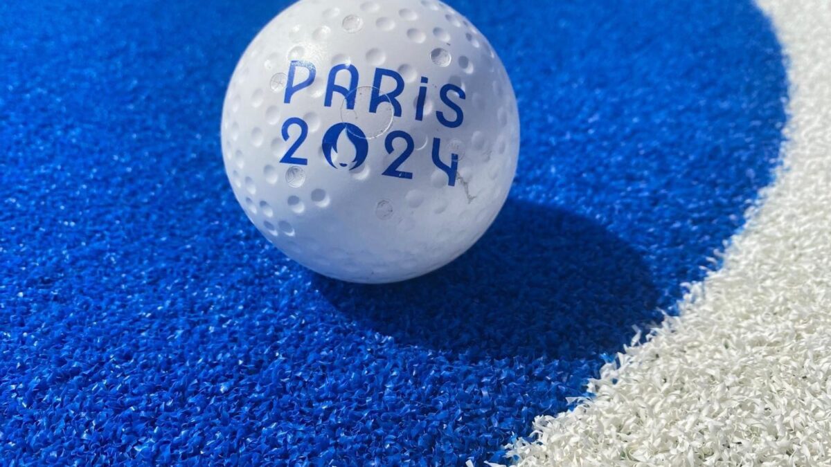 A hockey ball on the blue pitch at Yves du Manoir stadium, in Paris.
