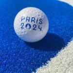 A hockey ball on the blue pitch at Yves du Manoir stadium, in Paris.
